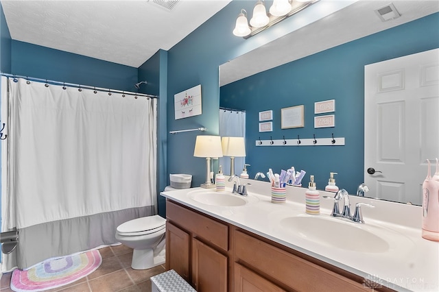 9378 Oak Brook Dr, Clearcreek Twp, OH 45458 - full bath with tile patterned floors, toilet, double vanity, and a shower with shower curtain