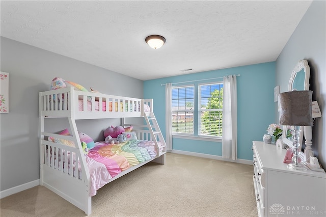 9378 Oak Brook Dr, Clearcreek Twp, OH 45458 - bedroom featuring light colored carpet, baseboards, and a textured ceiling