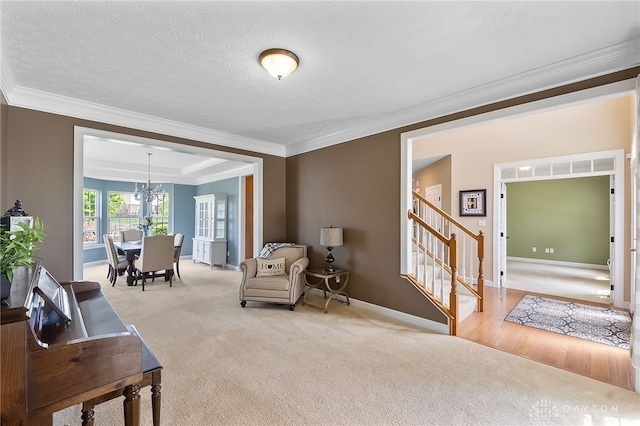 9378 Oak Brook Dr, Clearcreek Twp, OH 45458 - sitting room featuring crown molding, stairs, carpet, a chandelier, and baseboards
