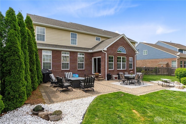 9378 Oak Brook Dr, Clearcreek Twp, OH 45458 - back of house with brick siding and a patio area