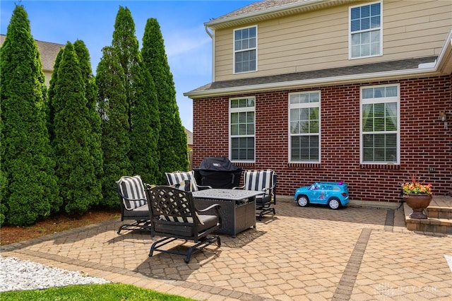 9378 Oak Brook Dr, Clearcreek Twp, OH 45458 - view of patio / terrace with an outdoor fire pit