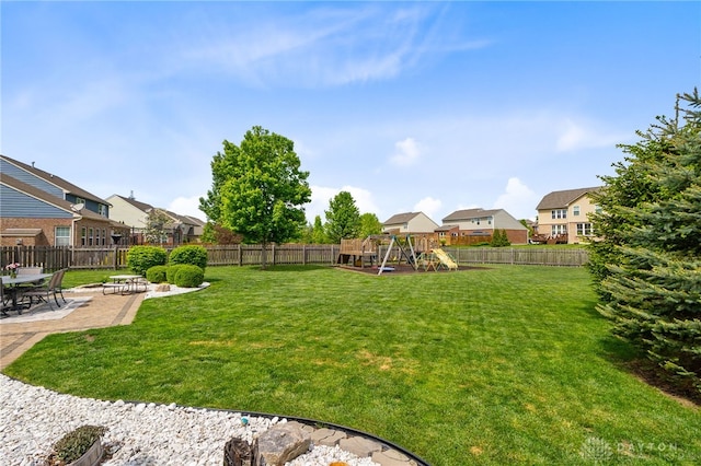9378 Oak Brook Dr, Clearcreek Twp, OH 45458 - view of yard featuring a playground, a patio area, and a residential view