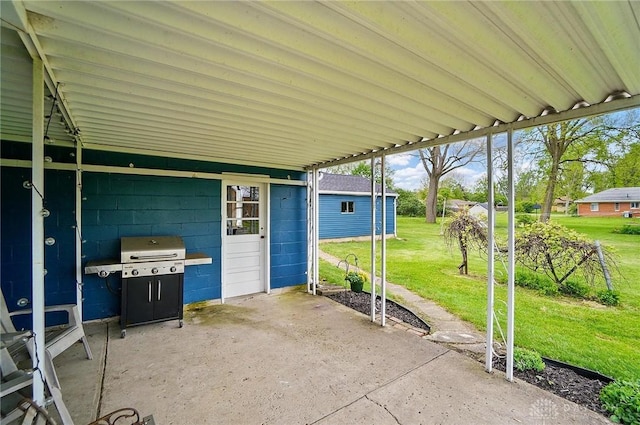 view of patio featuring grilling area and an outbuilding