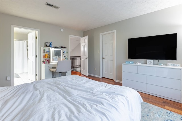 2540 Greenside Dr, Beavercreek, OH 45431 - bedroom featuring wood finished floors and connected bathroom