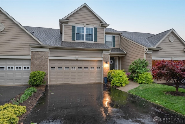 2540 Greenside Dr, Beavercreek, OH 45431 - traditional-style house with driveway, a shingled roof, and brick siding
