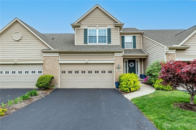 2540 Greenside Dr, Beavercreek, OH 45431 - traditional-style house featuring driveway, a shingled roof, and brick siding
