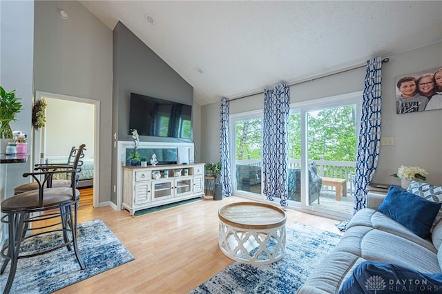 2540 Greenside Dr, Beavercreek, OH 45431 - living area featuring light wood-style flooring and high vaulted ceiling