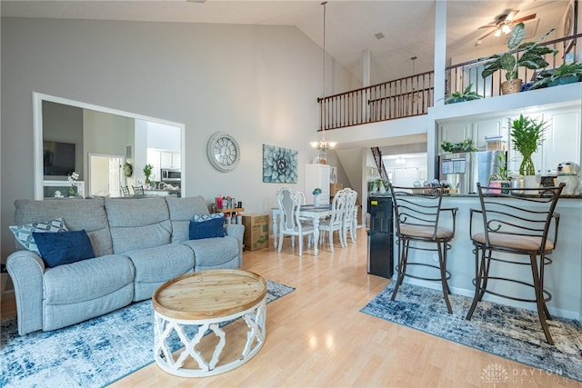 2540 Greenside Dr, Beavercreek, OH 45431 - living room with high vaulted ceiling, wood finished floors, and ceiling fan