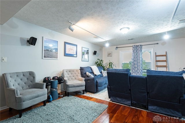 2540 Greenside Dr, Beavercreek, OH 45431 - living room featuring wood finished floors, a textured ceiling, and rail lighting