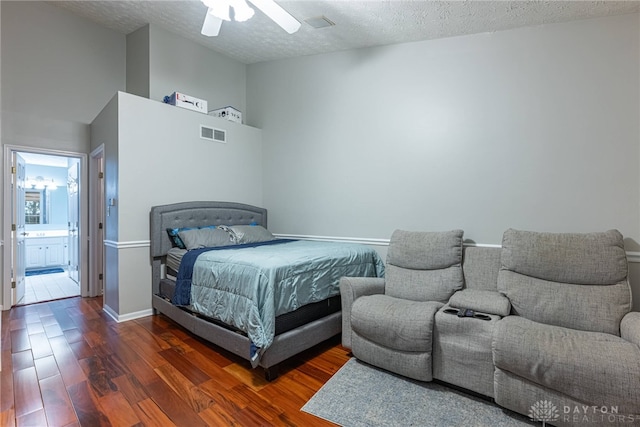 2540 Greenside Dr, Beavercreek, OH 45431 - bedroom with wood finished floors, a textured ceiling, connected bathroom, a ceiling fan, and baseboards