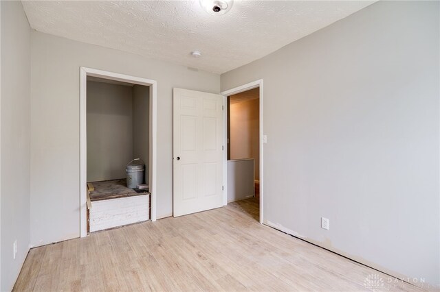 18241826 W Grand Ave, Dayton, OH 45402 - unfurnished bedroom with light wood-style flooring and ensuite bath