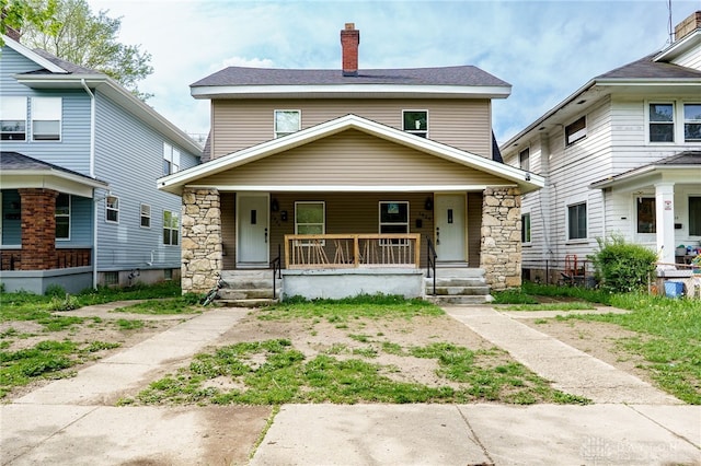 18241826 W Grand Ave, Dayton, OH 45402 - traditional style home with covered porch, a chimney, and stone siding