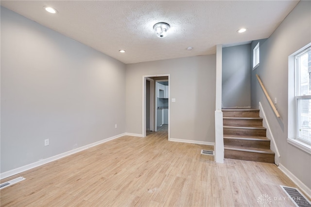 18241826 W Grand Ave, Dayton, OH 45402 - stairway with wood finished floors, baseboards, recessed lighting, and a textured ceiling