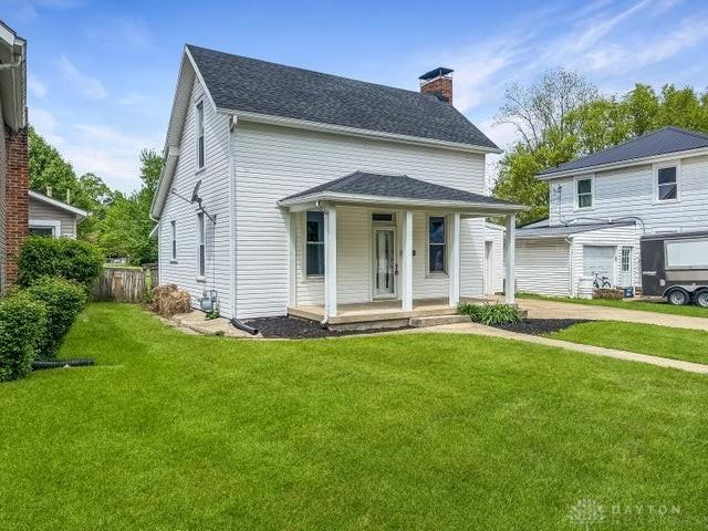 244 Windsor Ave, Urbana, OH 43078 - view of front of house with covered porch, a chimney, and roof with shingles