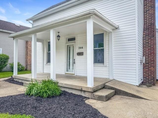 244 Windsor Ave, Urbana, OH 43078 - doorway to property with covered porch