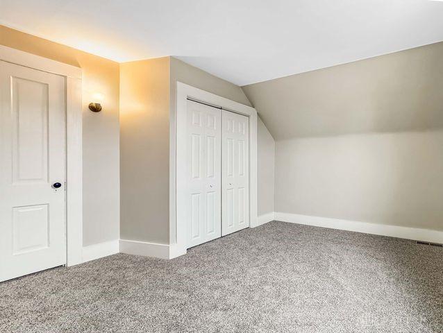 244 Windsor Ave, Urbana, OH 43078 - bonus room featuring carpet floors, lofted ceiling, and baseboards