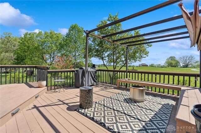 wooden deck featuring a pergola