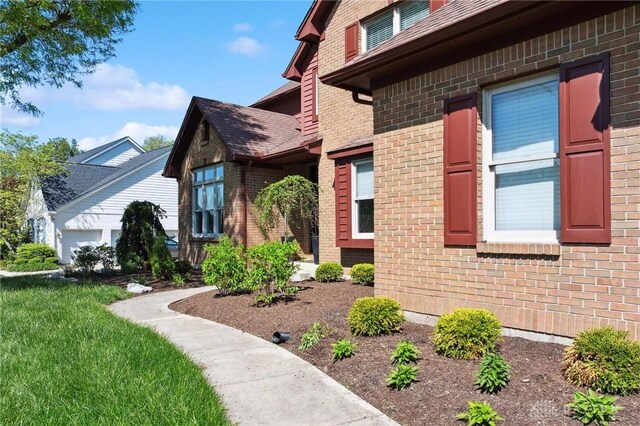 doorway to property featuring brick siding