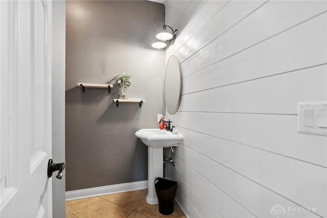 bathroom featuring tile patterned flooring and baseboards