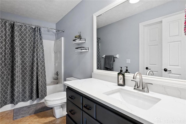 bathroom with a textured ceiling, toilet, tile patterned floors, shower / tub combo with curtain, and vanity