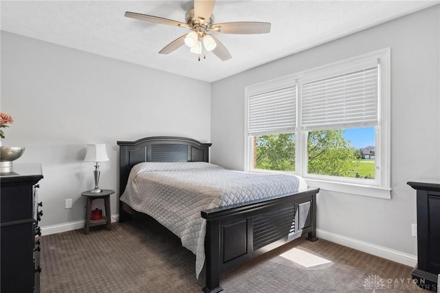 bedroom with carpet floors, baseboards, and a ceiling fan