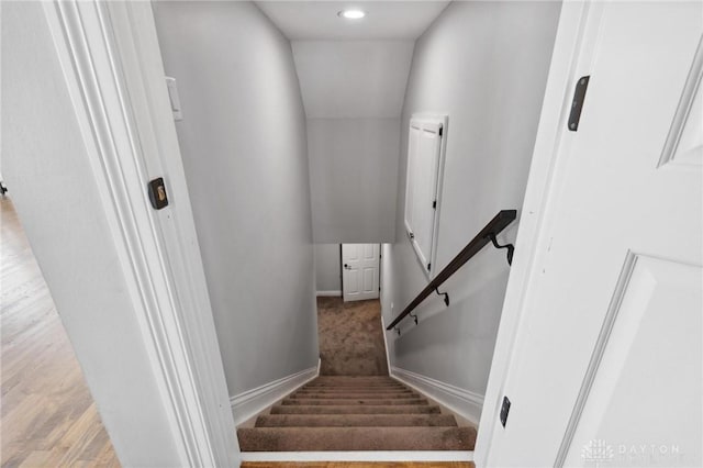stairs featuring baseboards and recessed lighting