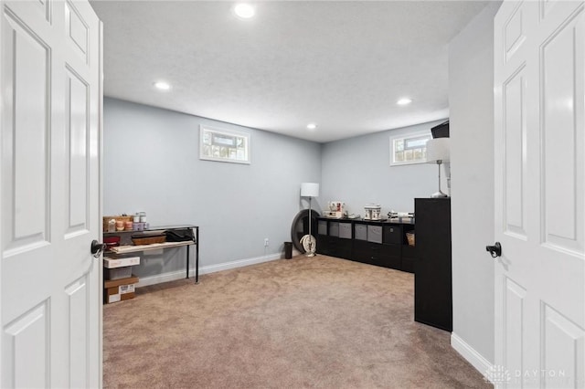 carpeted office space featuring recessed lighting and baseboards