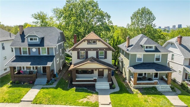 221 Virginia Ave, Dayton, OH 45410 - traditional style home with covered porch, a front yard, and a residential view