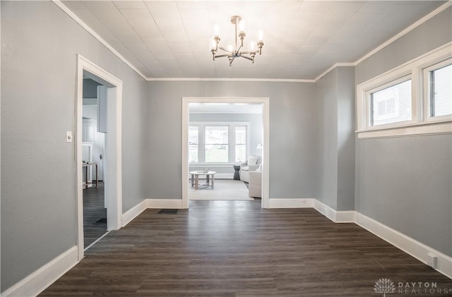 221 Virginia Ave, Dayton, OH 45410 - unfurnished dining area featuring a chandelier, ornamental molding, and dark wood-type flooring