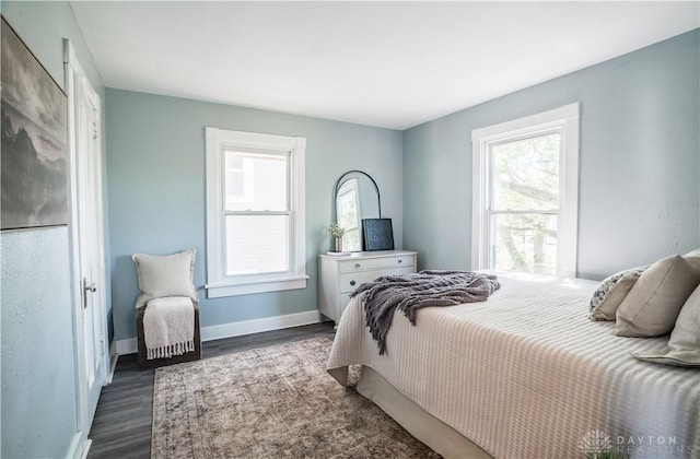 221 Virginia Ave, Dayton, OH 45410 - bedroom with multiple windows and dark wood finished floors