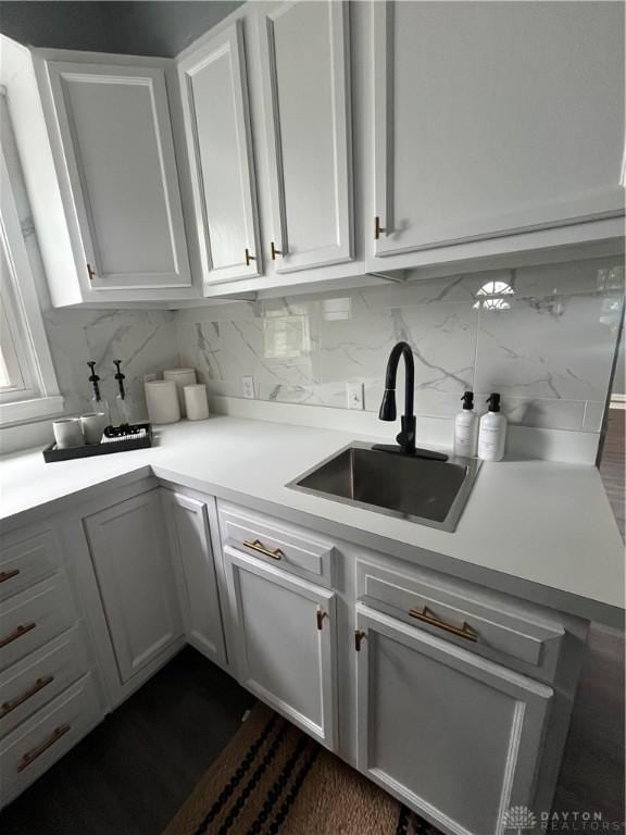221 Virginia Ave, Dayton, OH 45410 - kitchen with tasteful backsplash, white cabinetry, and light countertops