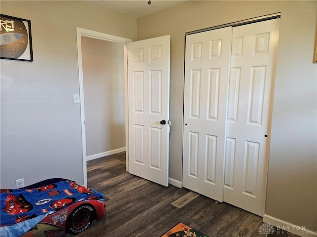 5107 Christy Ave, Dayton, OH 45431 - unfurnished bedroom with dark wood-type flooring, baseboards, and a closet