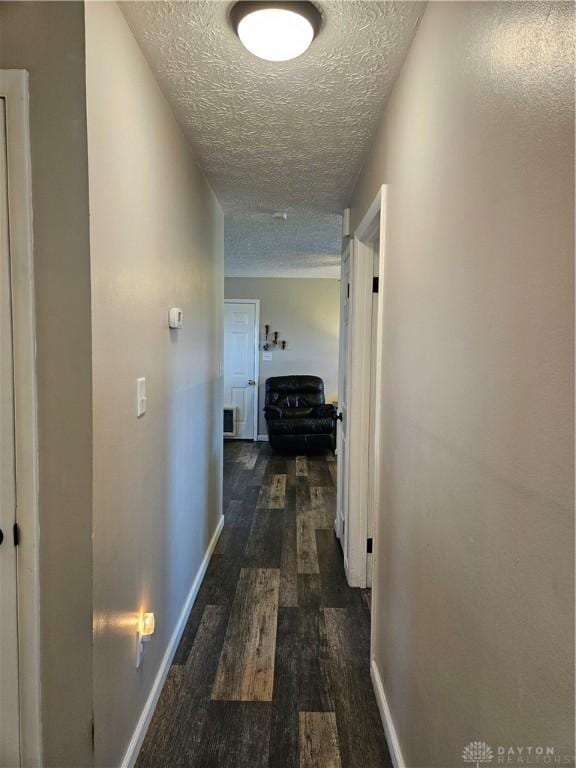 5107 Christy Ave, Dayton, OH 45431 - hallway with a textured ceiling, wood finished floors, and baseboards