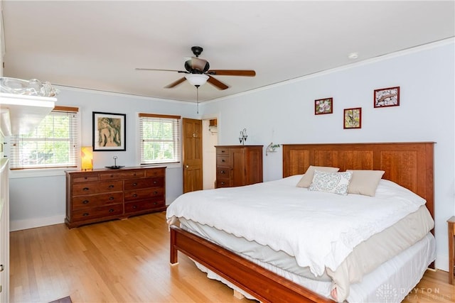 135 E Dixon Ave, Oakwood, OH 45419 - bedroom with light wood-style floors, crown molding, baseboards, and ceiling fan