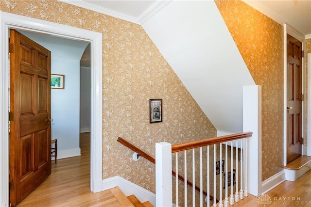 135 E Dixon Ave, Oakwood, OH 45419 - hallway with wood finished floors, wallpapered walls, ornamental molding, an upstairs landing, and baseboards