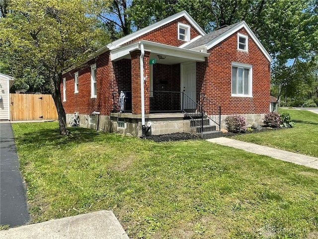 12 Harshman St, Brookville, OH 45309 - bungalow-style house featuring brick siding and covered porch