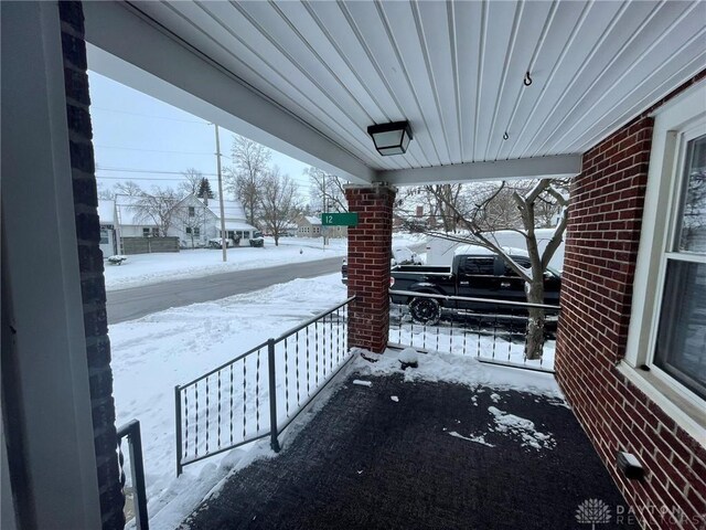 12 Harshman St, Brookville, OH 45309 - snow covered patio with covered porch