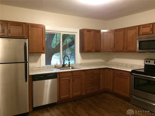 12 Harshman St, Brookville, OH 45309 - kitchen featuring appliances with stainless steel finishes, a sink, dark wood finished floors, and light countertops