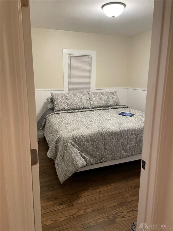 12 Harshman St, Brookville, OH 45309 - bedroom with dark wood finished floors and a wainscoted wall