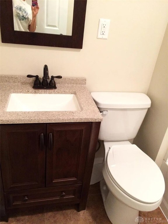 12 Harshman St, Brookville, OH 45309 - bathroom featuring vanity and toilet