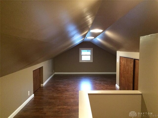 12 Harshman St, Brookville, OH 45309 - bonus room with wood finished floors, baseboards, and vaulted ceiling