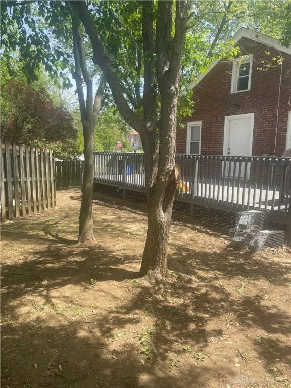 12 Harshman St, Brookville, OH 45309 - view of yard featuring a deck and fence