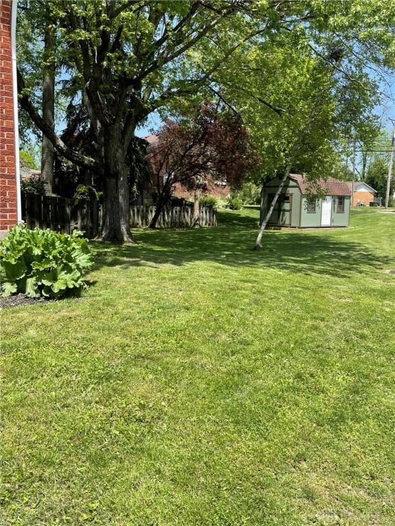 12 Harshman St, Brookville, OH 45309 - view of yard with a storage shed and an outbuilding