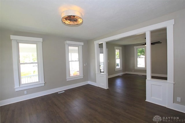 224 Suttman St, Miamisburg, OH 45342 - empty room featuring dark wood-style flooring, baseboards, and ceiling fan