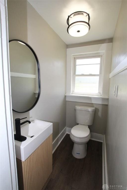 224 Suttman St, Miamisburg, OH 45342 - bathroom with baseboards, toilet, wood finished floors, and vanity