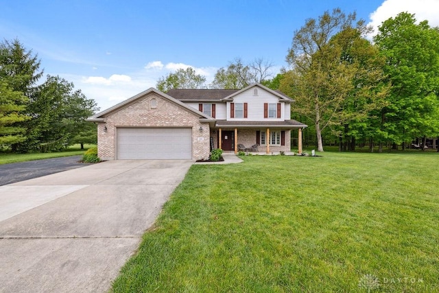 traditional home with concrete driveway, an attached garage, brick siding, a front lawn, and covered porch