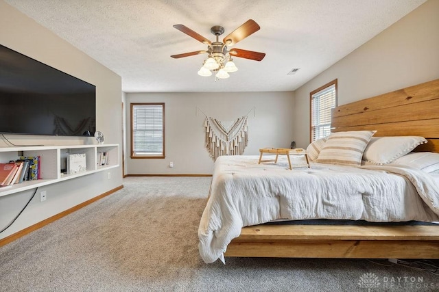 bedroom with carpet flooring, baseboards, and ceiling fan