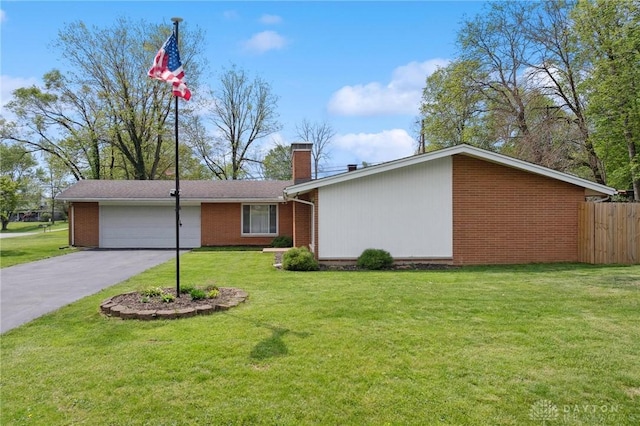 view of front of house featuring an attached garage, brick siding, a chimney, and driveway