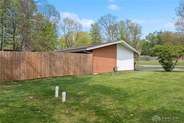 view of side of property with brick siding