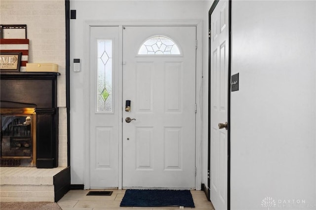 foyer featuring baseboards